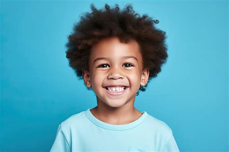 Premium Ai Image Smiling African American Kid Boy Portrait On Blue