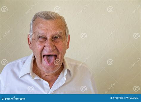 Elderly Guy Sticking Out Tongue Stock Photo Image Of Older Aged