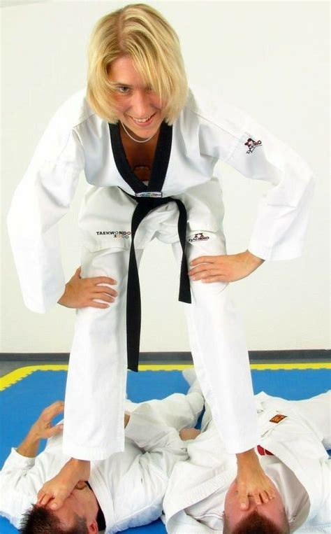kicked in the groin victory pose mixed wrestling karate girl female fighter judo foot
