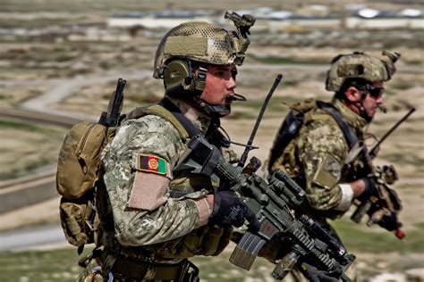 Afghan National Army Commandos Running To A Compound During A Live