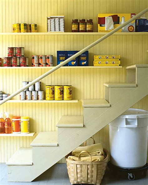 Tuck a beautiful cabinet under your stairs for a storage option that is as purposeful as it is gorgeous. 10 Best Pantry Storage Ideas | Martha Stewart