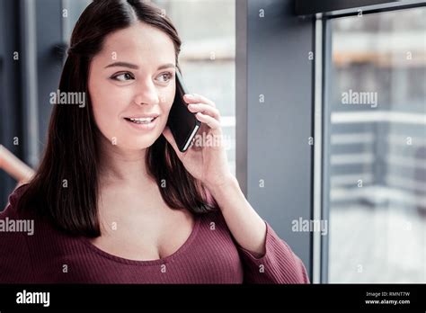 Dark Haired Cutie Dark Haired Cute Dreamy Woman Feeling Fascinated While Talking By Phone With