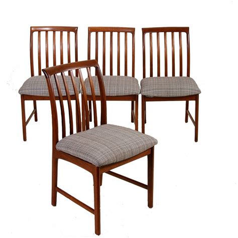 set of four modern walnut dining chairs by folke ohlsson for dux at 1stdibs