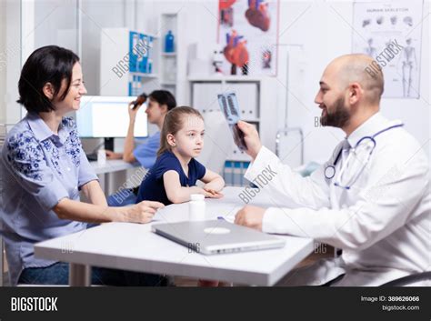 Pediatrician Examining Image And Photo Free Trial Bigstock