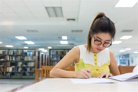 Young Woman Writing Essay