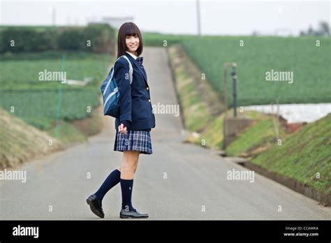 Female High School Student Standing On Rural Road Stock Photo Alamy