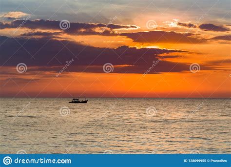 Fishing Boat Over Sunset Seacoast Skyline Stock Image Image Of Orange