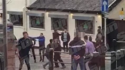sickening footage shows rival celtic and rangers fans clash in brutal mass fight in middle of