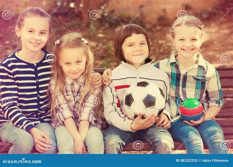 Kids Posing Together With Ball Stock Image Image Of Friendship