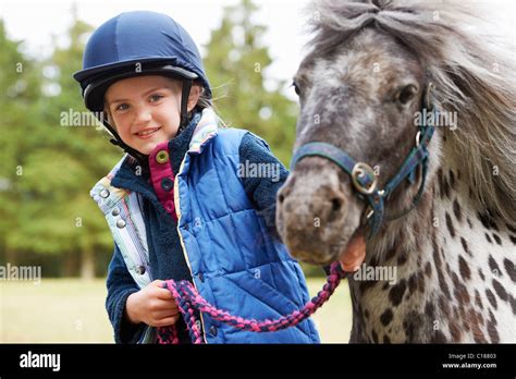 Girl With Her Pony Stock Photo Alamy