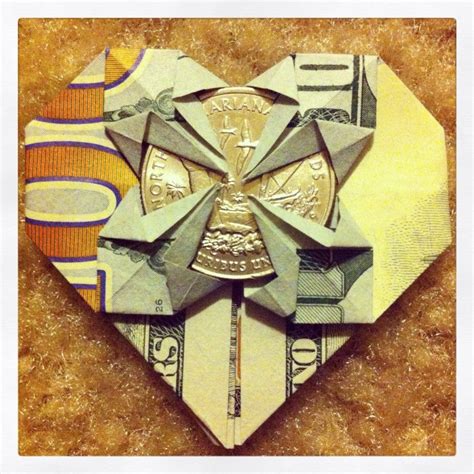 Origami Heart Shaped 100 Dollar Bill With A Quarter In The Center