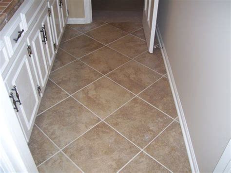 Instead of starting along a wall, you usually have to scribe a line down the middle of the the job will cost more even if you do it yourself, though, because of the wood you will waste on the end cuts. Diagonal tile pattern with large tiles | Flooring ...