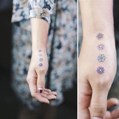 Little Tattoos — Four Flower Tattoos On The Hand Tattoo Artist