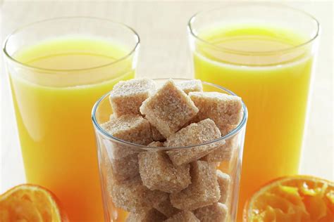 Freshly Squeezed Orange Juice And Sugar Cubes Photograph By Kevin