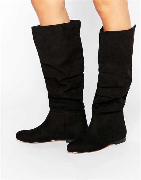 Lyst Asos Collaborate Knee High Flat Slouch Boots In Black