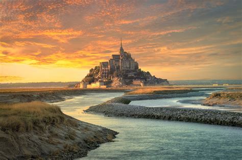 Le Mont Saint Michel Is A Tidal Island And Mainland Commune In Normandy