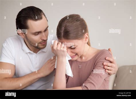 Husband Comforting Sad Crying Wife Man Consoling Sobbing Young Stock