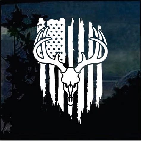 An American Flag And Deer Skull Decal On A Car Window With The