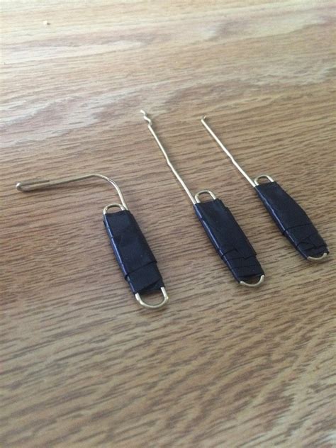 Keep feeding it through until the end of the paper clip comes back out the front where you can reach it. Ideal set of rushed improvised lock picks. Hook, rake, and tension wrench. : lockpicking