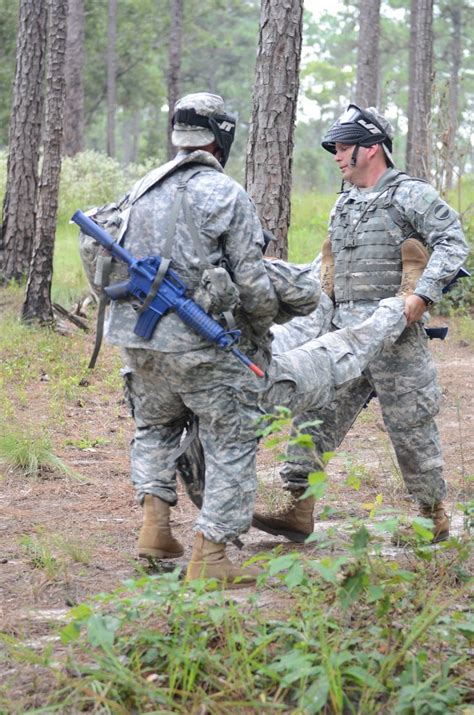 Soldiers From The 10th Pch Carry A Training Dummy To Safety As Part Of