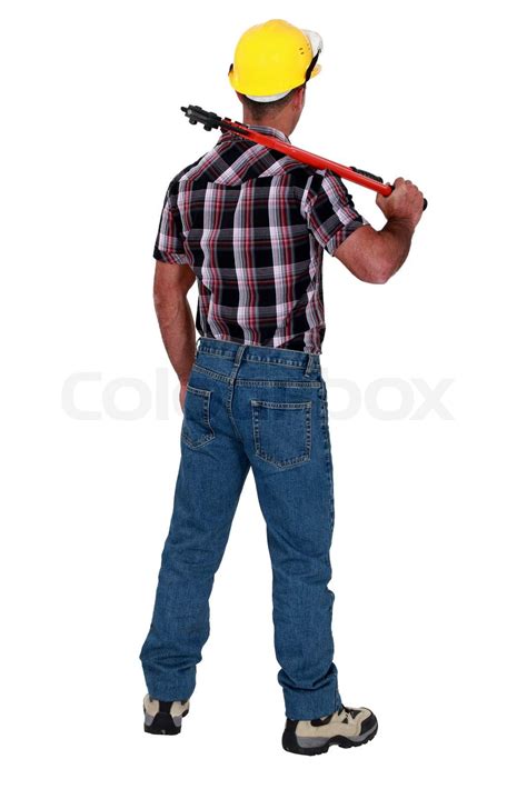 Man Holding Wrench With Back Turned Stock Image Colourbox