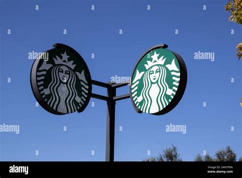 Starbucks Sign At Starbucks Coffee Shop Starbucks Is An American