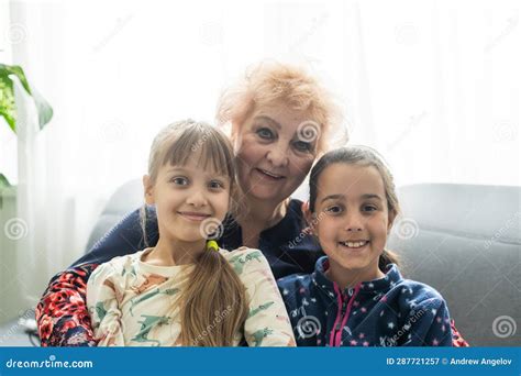 Smiling Loving Mature Grandmother And Two Granddaughters Stock Image Image Of Mature