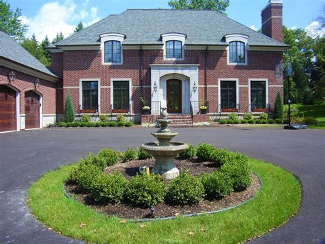 Circle Driveway With Boxwood Hedge Around Water Fountain In West