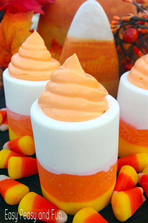 In each of 12 shot glasses, place a teaspoon of cookie crumbles followed by a layer of ganache and 2 tablespoons peanut butter cream. Candy Corn Shot Glasses - Halloween Desserts - Easy Peasy and Fun