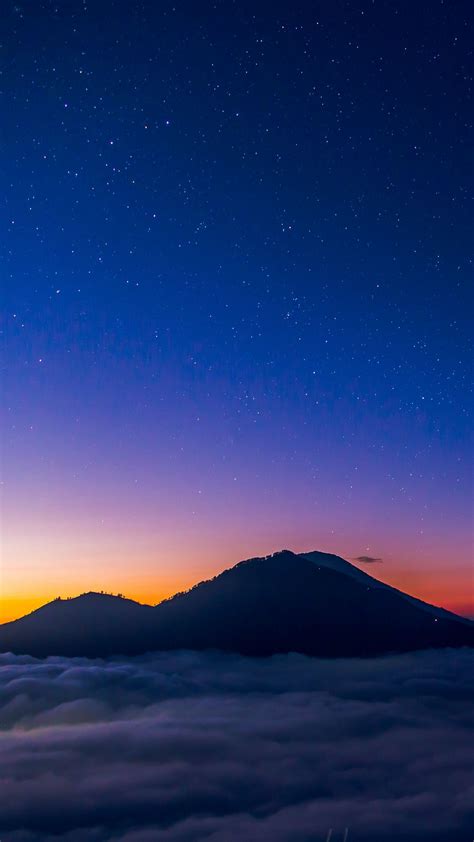 Download Wallpaper 1350x2400 Starry Sky Mountains Clouds Night