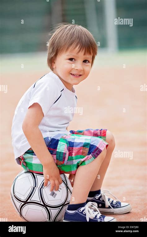 Cute Little Boy Playing Football Stock Photo Alamy