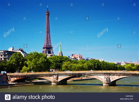 Eiffel Tower And Pont Des Invalides Bridge On Seine River In Paris