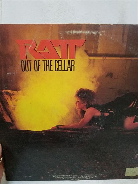The Album Cover For Ratt Out Of The Cellar Is Being Held Up By Someone