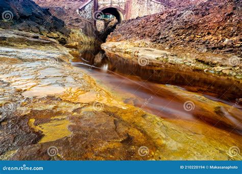 Abandoned Bridge And Mining Grounds With Colorful Rio Tinto River In