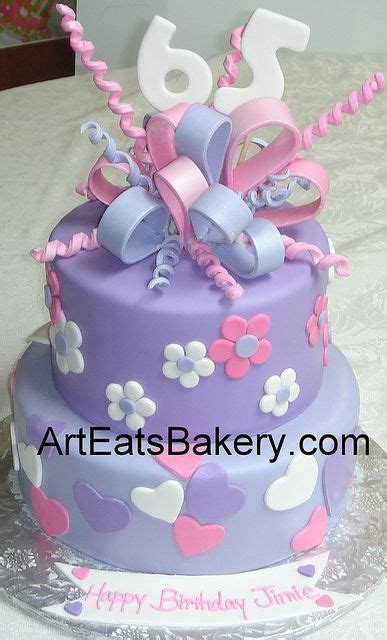 Two Tier Purple Pink And White Fondant Hearts And Flowers 65th Birthday Cake With Sugar Bow