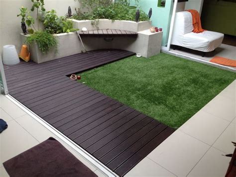 Contemporary rear garden with composite decking and artificial grass as view 1 but hedge more established. Another ideas for outdoor garden with Acesturf Artificial ...