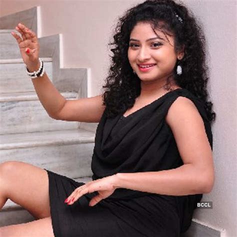 Vishnu Priya Sizzles In A Black Dress While She Poses During A Photoshoot