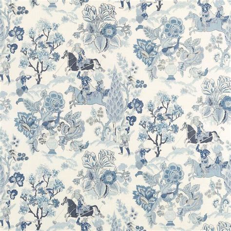 a blue and white wallpaper with flowers