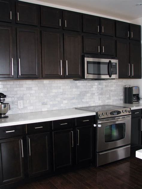 But don't call it safe. Dark Birch kitchen cabinets with Shining White Quartz ...