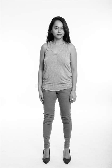 Full Body Shot Of Beautiful Woman Standing Against White Background