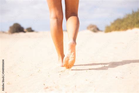 Close Up Of Sexy Nude Young Beautiful Woman Legs Walking On The Soft Sand At The Beach In Summer