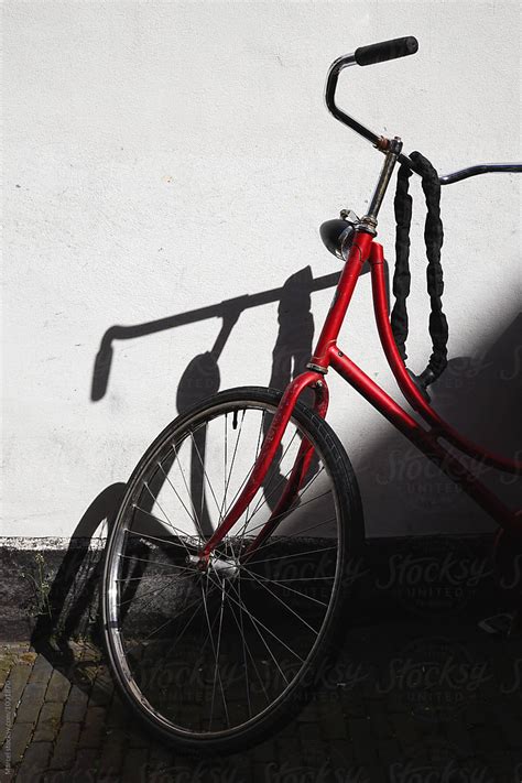 Red Bike And Shadow By Stocksy Contributor Marcel Stocksy