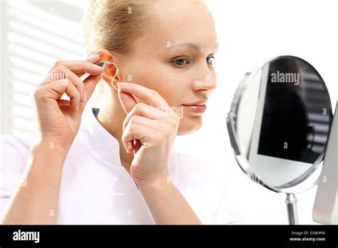 Young Woman With Hearing Aid Hi Res Stock Photography And Images Alamy