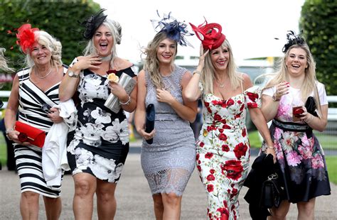 Goodwood Festival Ladies' Day: Windswept racegoers battle against 40mph winds and downpours on ...
