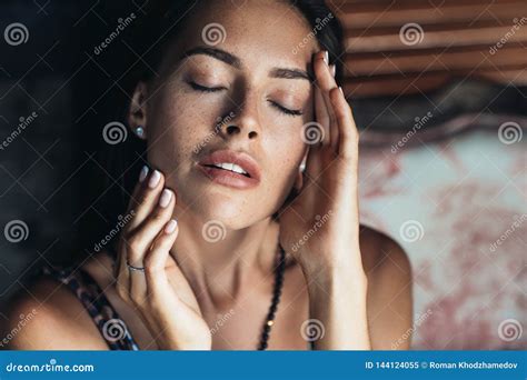 Portrait Of Sensual Brunette Girl With Closed Eyes And Natural Make Up
