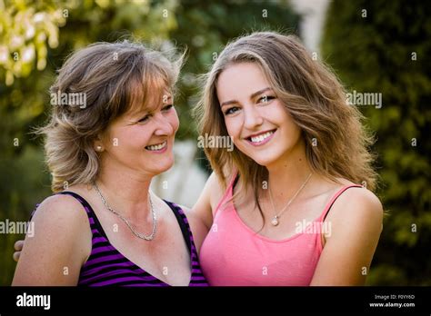 Portrait Of Mature Mother With Her Teenage Daughter Outdoor In Nature