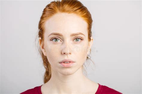 Beautiful Young Redhead Girl With Clean Fresh Face And Neutral Emotions