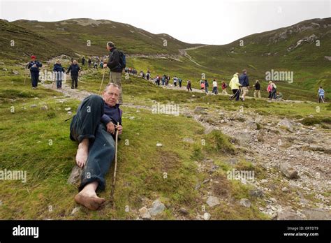 A Man In Bare Feet Resting While Climbing Croagh Patrick A Holy Stock