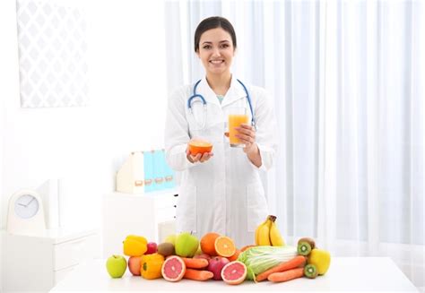 Premium Photo Female Nutritionist With Different Fruits And