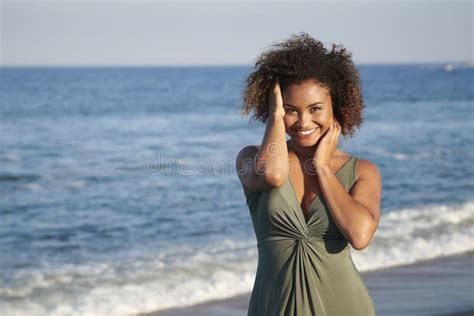 Stunning Young Biracial Woman On Beach Smiling Stock Image Image Of Posing Playful 164599867
